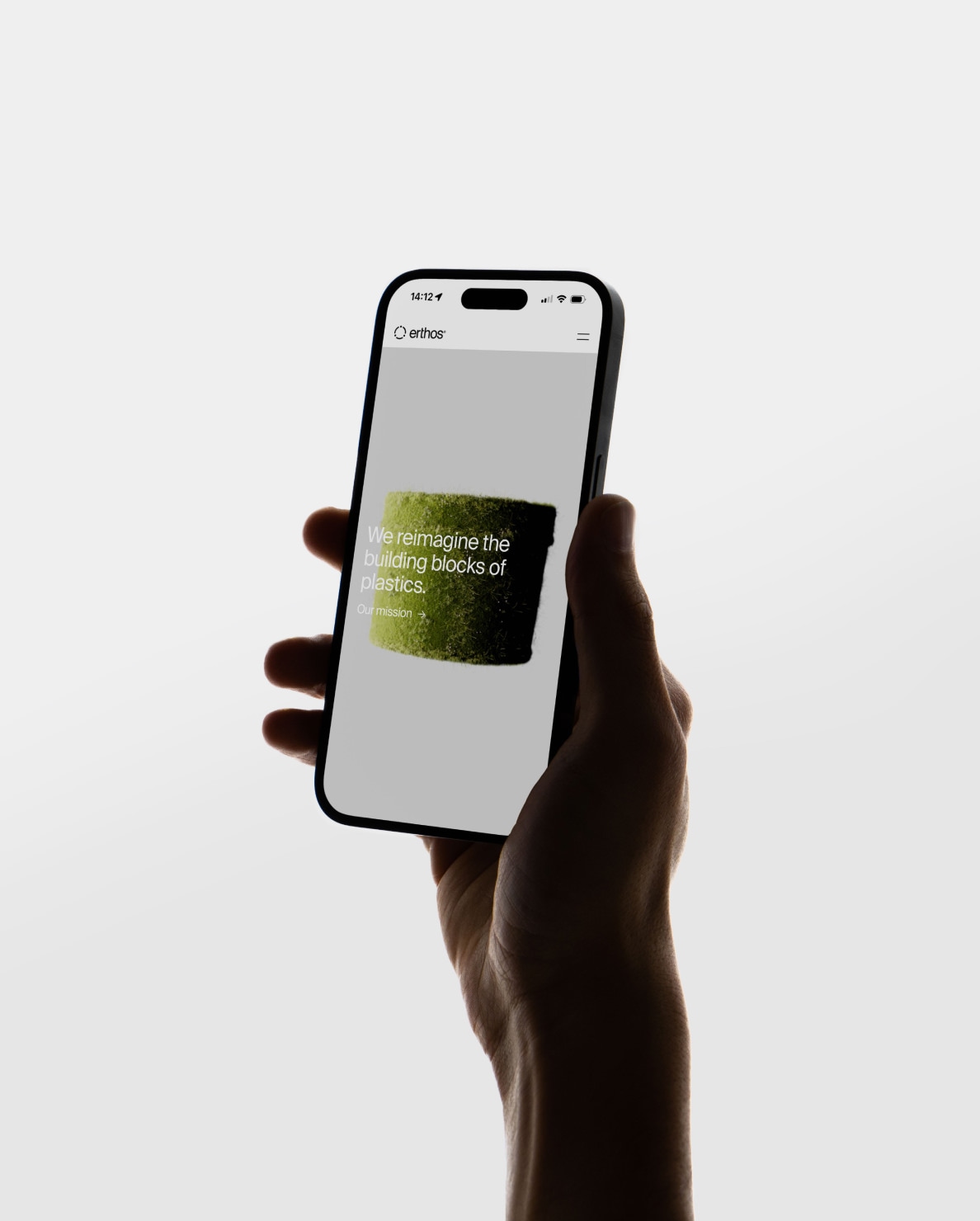 hand holding a phone showing the mobile site design
