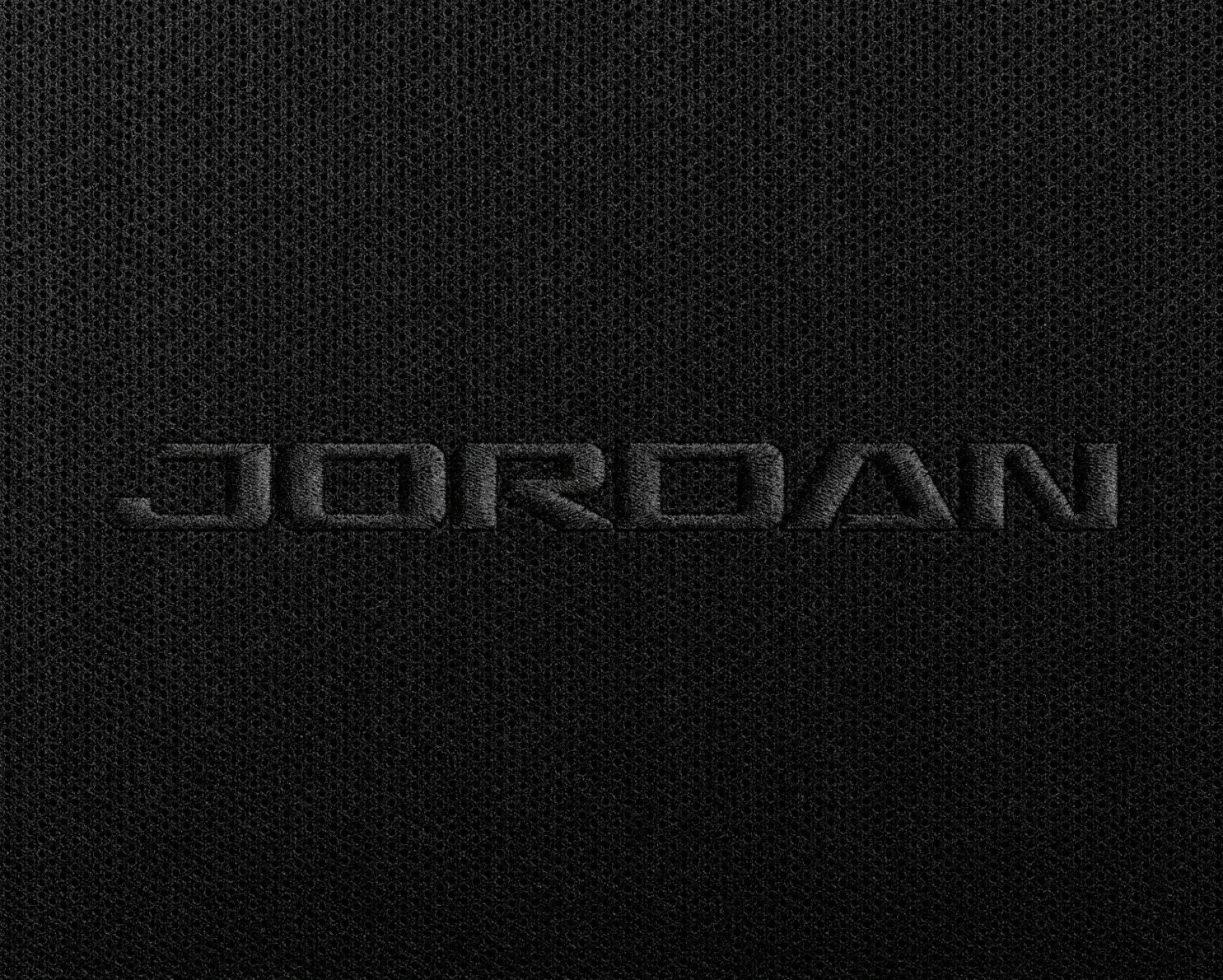 Black-on-black embroidered Jordan wordmark on ribbed technical fabric