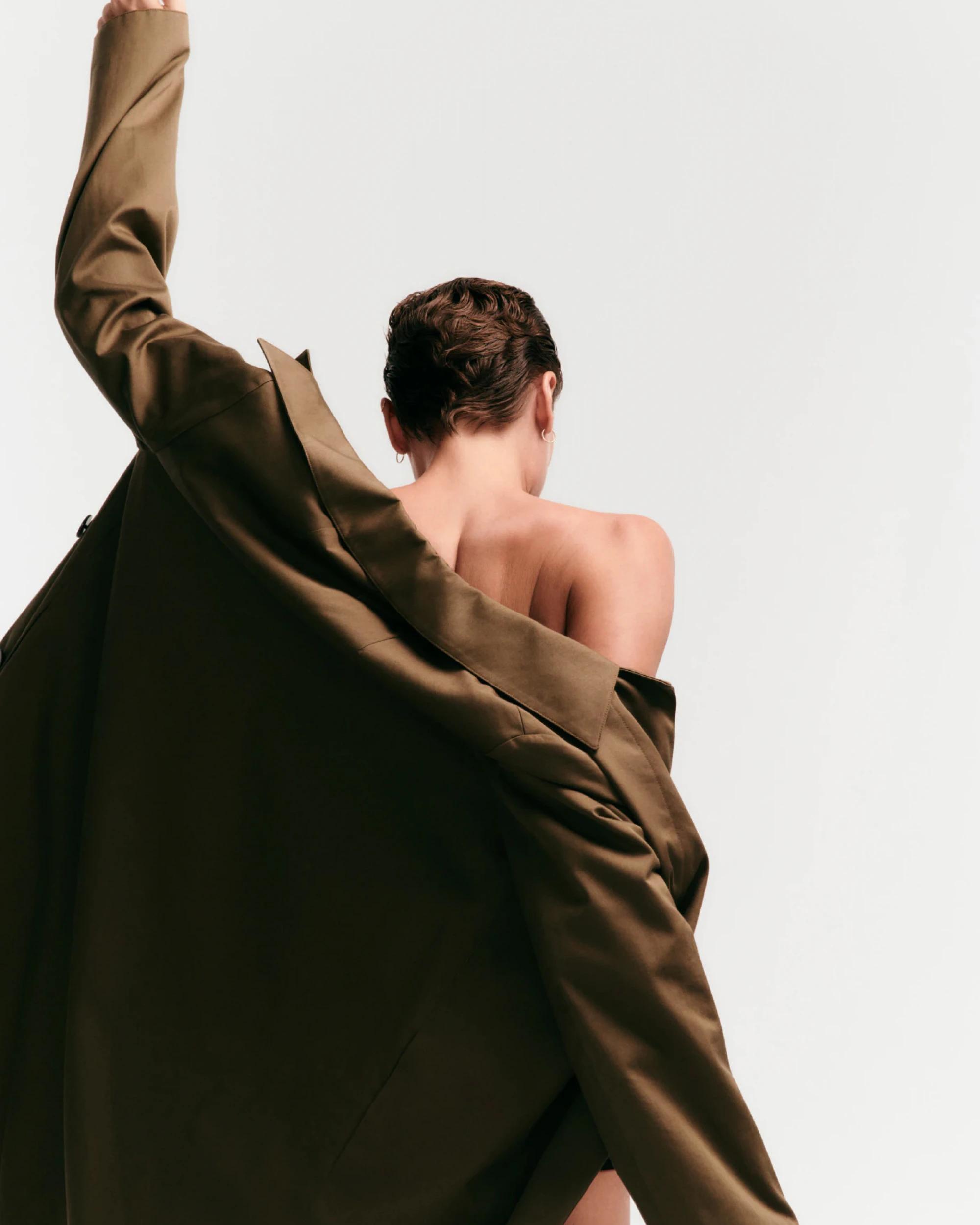 back,body part,person,formal wear,clothing,suit,fashion,coat,dress,dancing