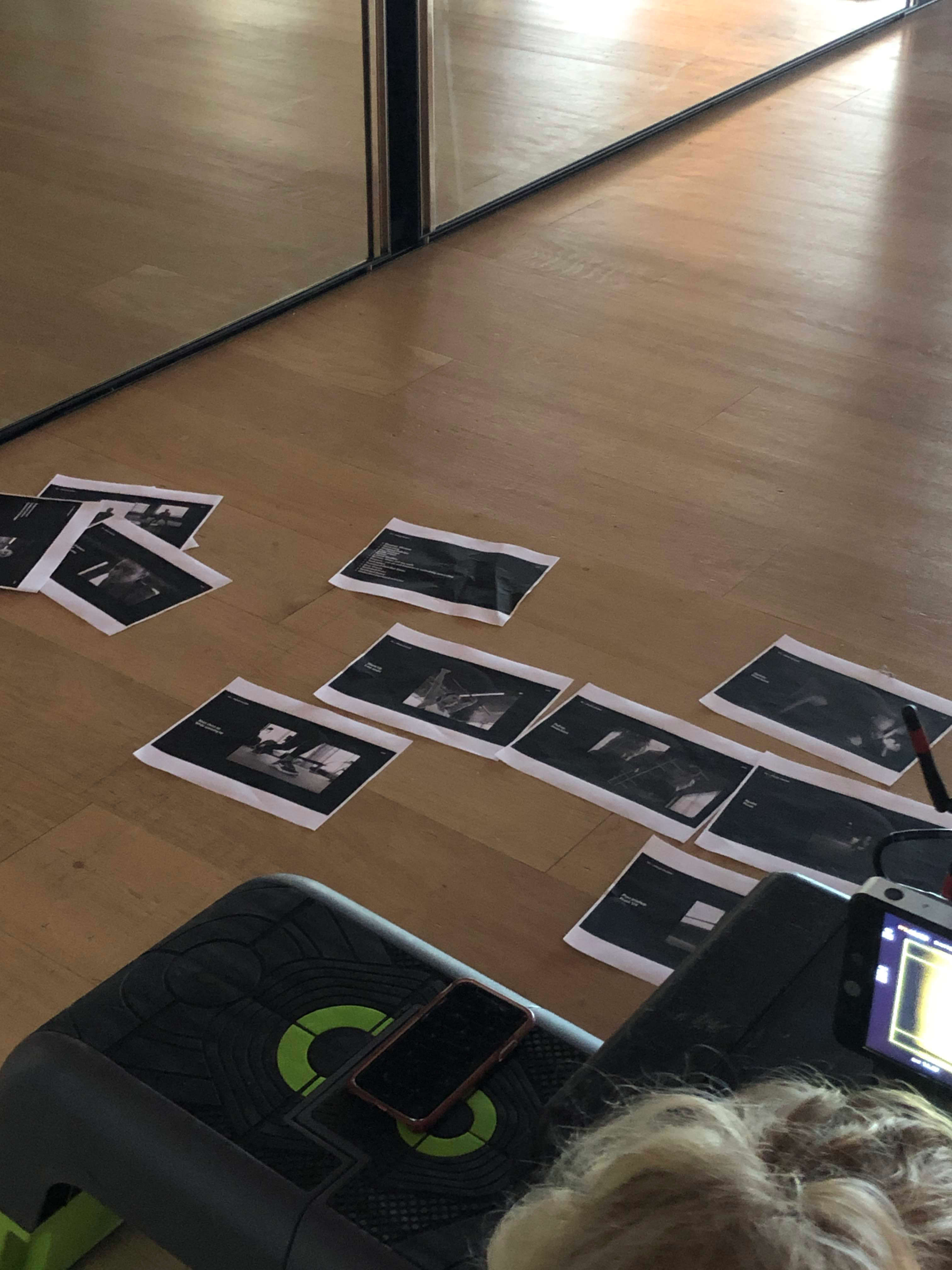 floor,mobile phone,flooring,interior design,child,female,girl,person,text,business card