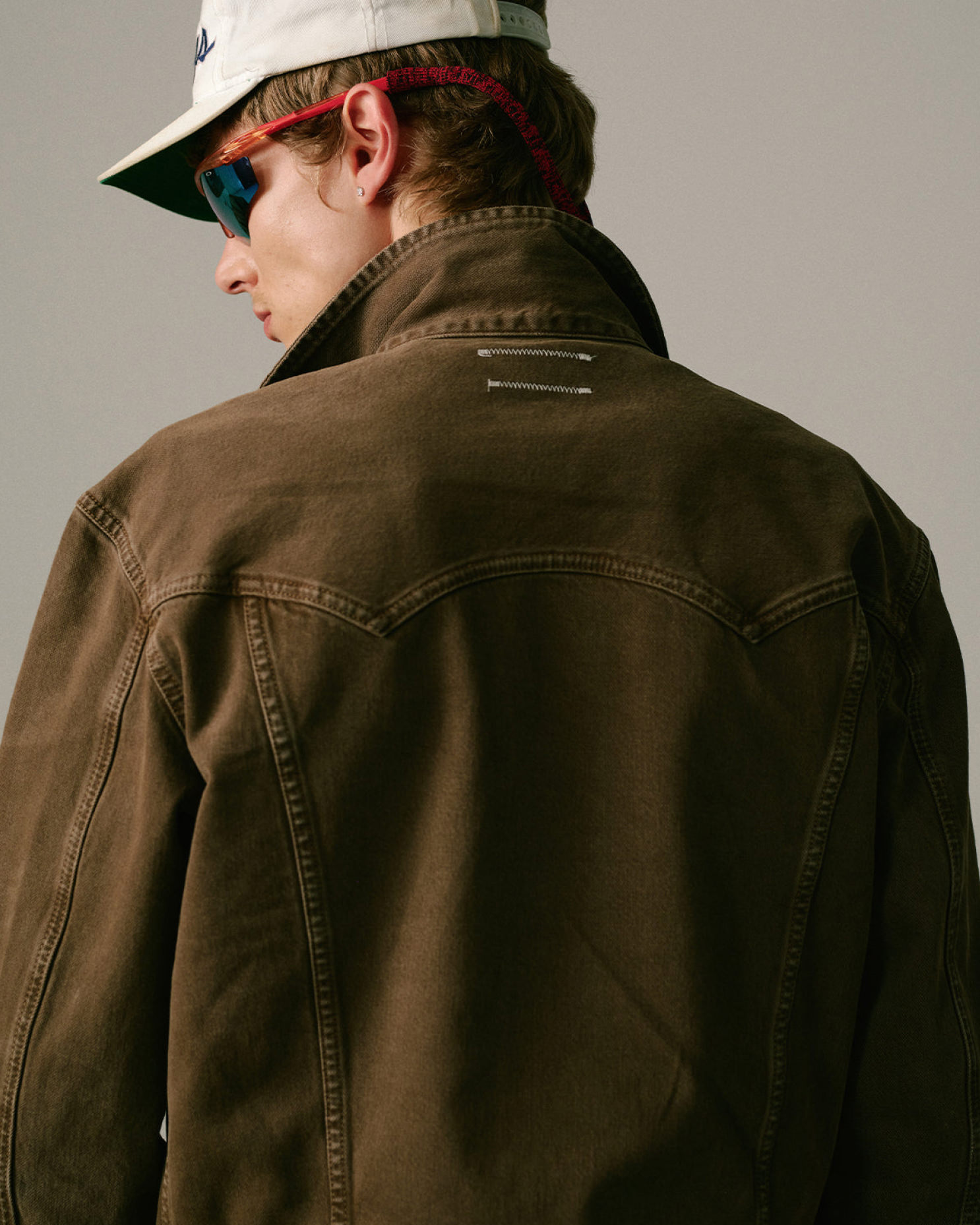 clothing,coat,jacket,adult,male,man,person,hat,accessories,glasses